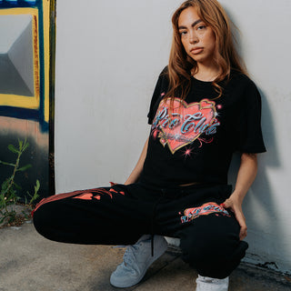 Women model posing against graffiti wall