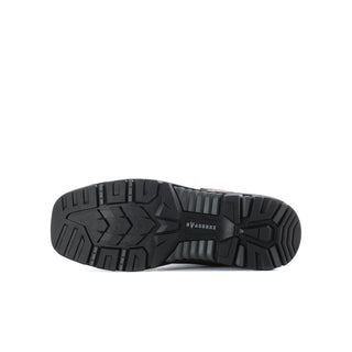 Underside of men's brown work boot with rugged black tread outsole