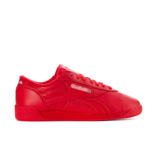 Women’s red Reebok low-top sneaker with lace-up front and side stripes