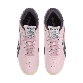 Women's pink low-top sneakers with lace-up front and Reebok logo on tongue
