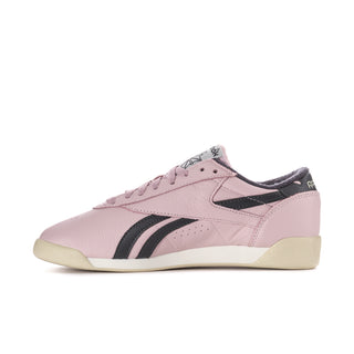 Women's pink low-top sneakers with black stripes and lace-up closure
