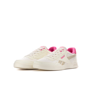 Youth white and pink Reebok court sneaker angled side view with pink collar