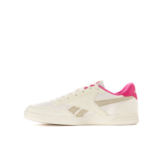 Youth white and pink Reebok court sneaker low-profile side view with laces