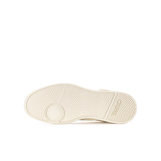 Youth white and pink Reebok sneaker outsole with traction tread pattern