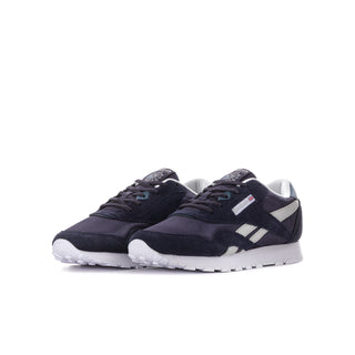 Youth Reebok sneakers in dark indigo with white stripes and lace-up front