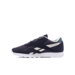 Youth Reebok sneakers side view, dark indigo upper with white stripe panel