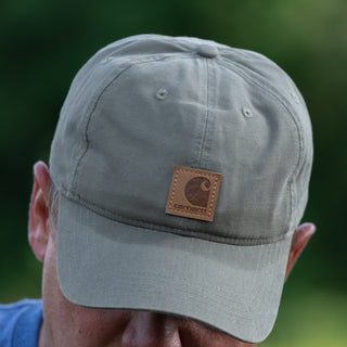 Gray canvas dad cap with Carhartt leather patch and curved brim