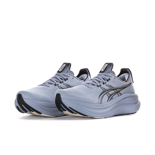 Men's running shoes, side view, light blue upper with logo detailing and thick sole