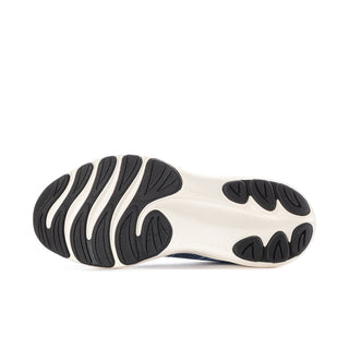 Rubber outsole tread on a white platform midsole with dark traction pods