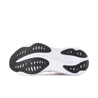 Women's running shoe outsole view, white midsole with dark traction pods