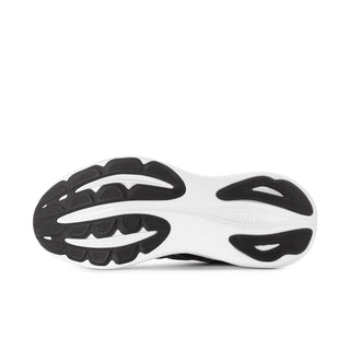 Women’s black and white running sneaker outsole with visible tread pattern.