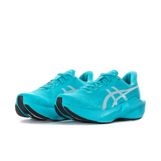 Women's turquoise lace-up running shoes, low sole with black heel and toe trim.