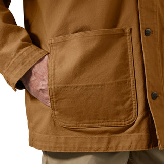 Brown denim jacket front pocket with contrast stitching and button details