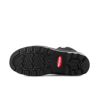Women's black boots outsole close-up with zigzag grip tread pattern