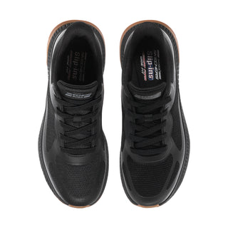 Pair of black slip-on sneakers showing cushioned tongue and laces