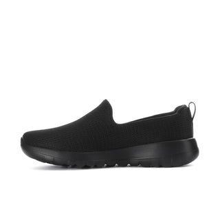 Black slip-on walking shoe with textured upper and cushioned rubber outsole