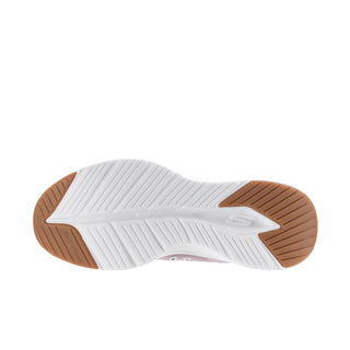 Women's sneaker outsole view with white tread and brown side edges