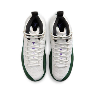 Youth sneaker pair with white uppers, green trim, and lace loops; top view