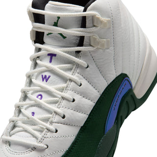 Youth high-top sneaker close-up: white laces with multi-color letters and green side panel