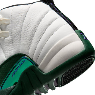 Youth high-top sneaker close-up with white ridged overlays and green side midsole accents