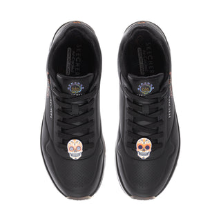 Men's black sneakers with lace-up front and embroidered skull logo