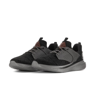 Pair of men's relaxed-fit sneakers with black knit uppers, charcoal panels, and gray soles