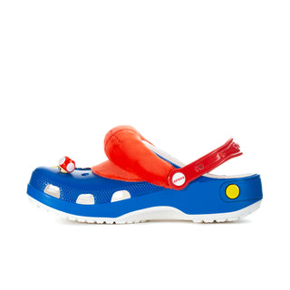 Men's blue clog with red slip strap, cartoon charms, and yellow side button detail