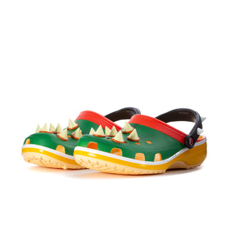 Men's classic clog with green upper, red slingback strap, orange heel detail, yellow sole.