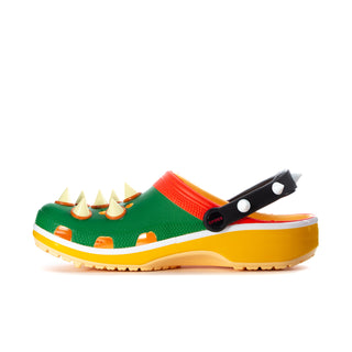 Men's classic clog side view: green with orange and red accents, black strap, yellow sole.
