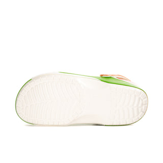 Underside of green clogs with white outsole tread and logo trim