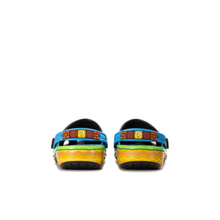 Pair of youth blue clogs with green/yellow heel bands and black back straps.