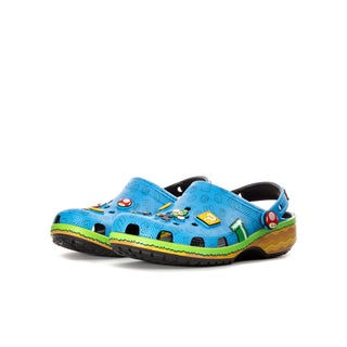 Kids blue clog with colorful character decorations, green trim, and yellow wave sole