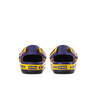 Men's purple Crocband clogs viewed from back with yellow straps and heel openings.