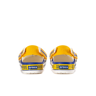 Rear view of men's blue slip-on clogs with yellow heel tabs and team text