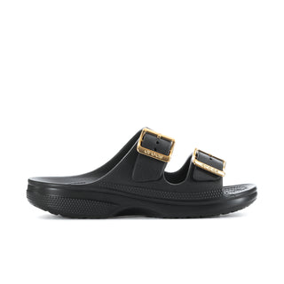 Women's black slide sandals with gold buckle straps and textured footbed