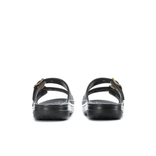 Women's black slide sandals from heel view with gold buckles and sling straps