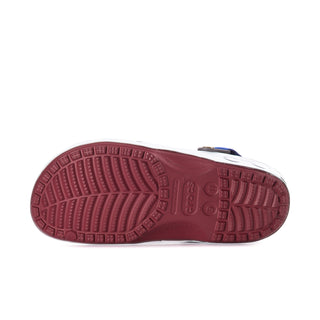 Outsole view of men's clogs with burgundy textured tread and blue strap hardware