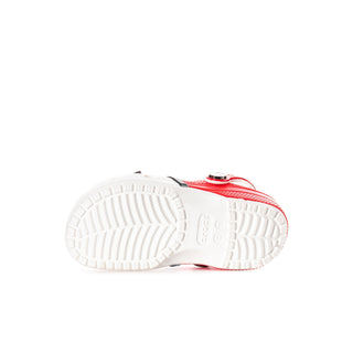 Kids' clog outsole view with white tread and red side edge