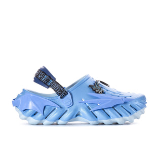 Men's blue clogs with dark graphic strap and metal emblem, thick tread sole