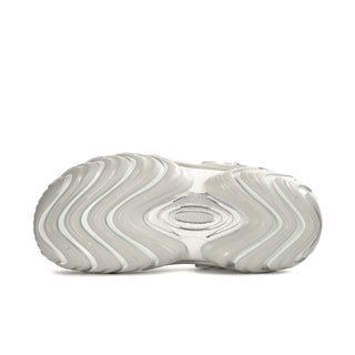 Mens white clog outsole with wavy tread pattern and oval heel logo