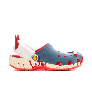 Women’s blue clog with white faux-fur lining, red spikes, and red splatter sole trim