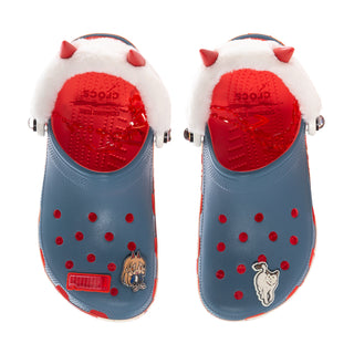 Women’s blue clog interior view with red textured footbed and white faux-fur hat trim