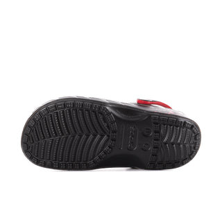 Black clog outsole with textured tread and circular logo detail