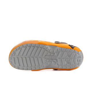 Men's orange lined clog outsole with tread pattern and black strap