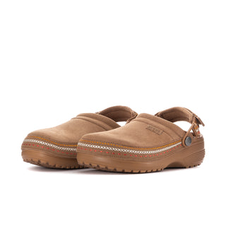 Pair of sepia slip-on clogs with woven trim around the edges and chunky tread sole