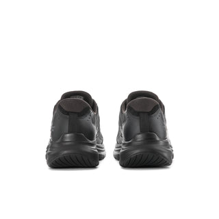 Men's black sneaker heels with cushioned collar and textured tread sole
