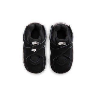 Toddler black low-top sneaker, front inner view with padded collar and strap