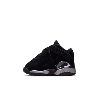 Toddler black low-top sneaker, side view with silver air-style panel and Jordan logo