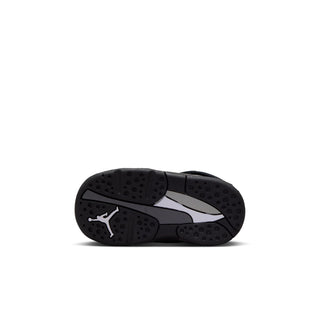 Toddler sneaker outsole view with textured black tread and gray midsole edge