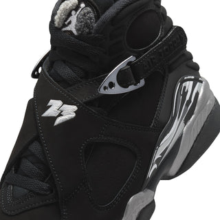 Youth black high-top sneakers with adjustable strap, silver detailing, and Jumpman logo
